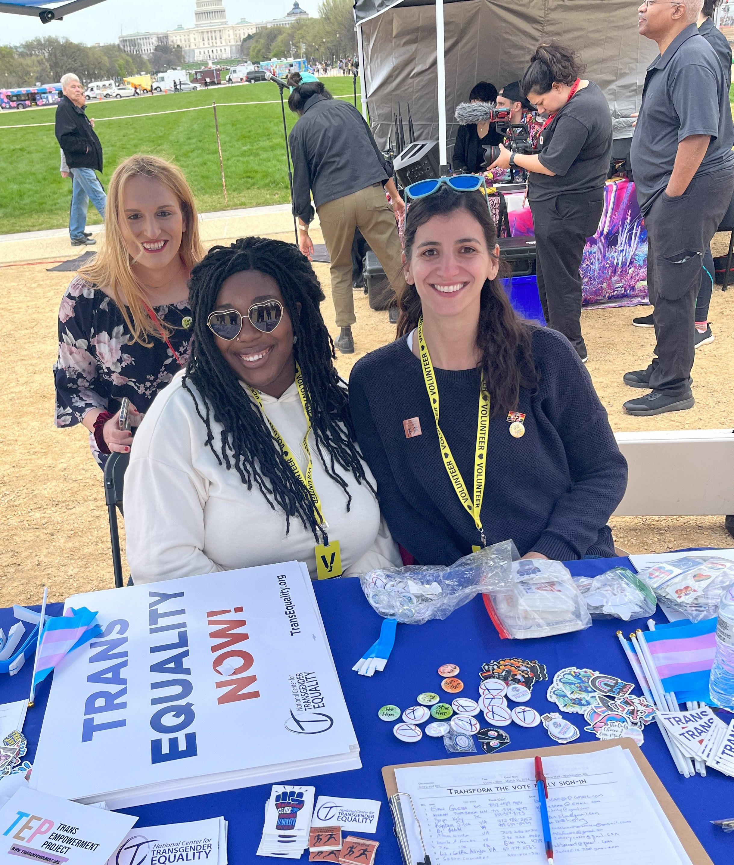 Volunteers smile at the Transform the Vote Rally. 